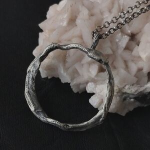 Uneven Creations Ourobouros circle serpent snake pendant